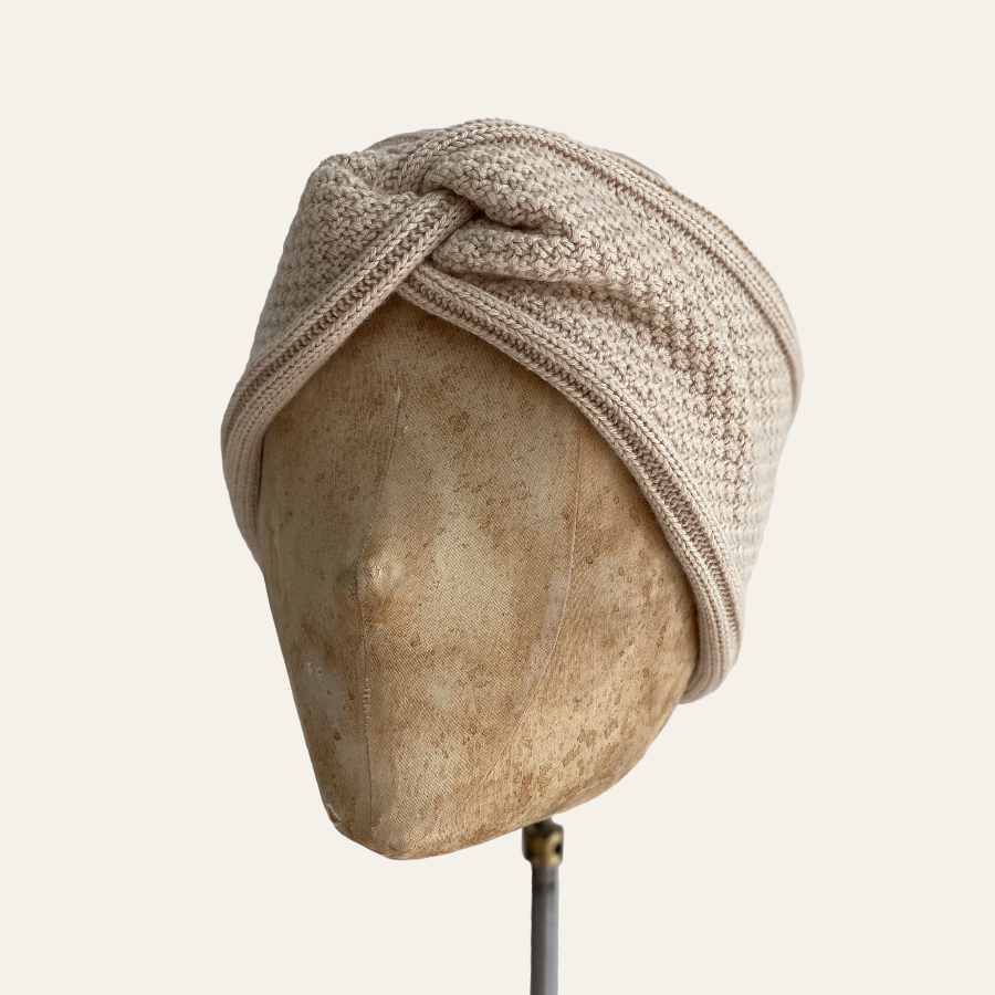 knitted cream headband on mannequin head