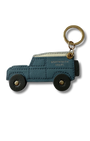 Blue off road car-shaped keychain with gold accents on a white background and black wheels.  stitch detail 