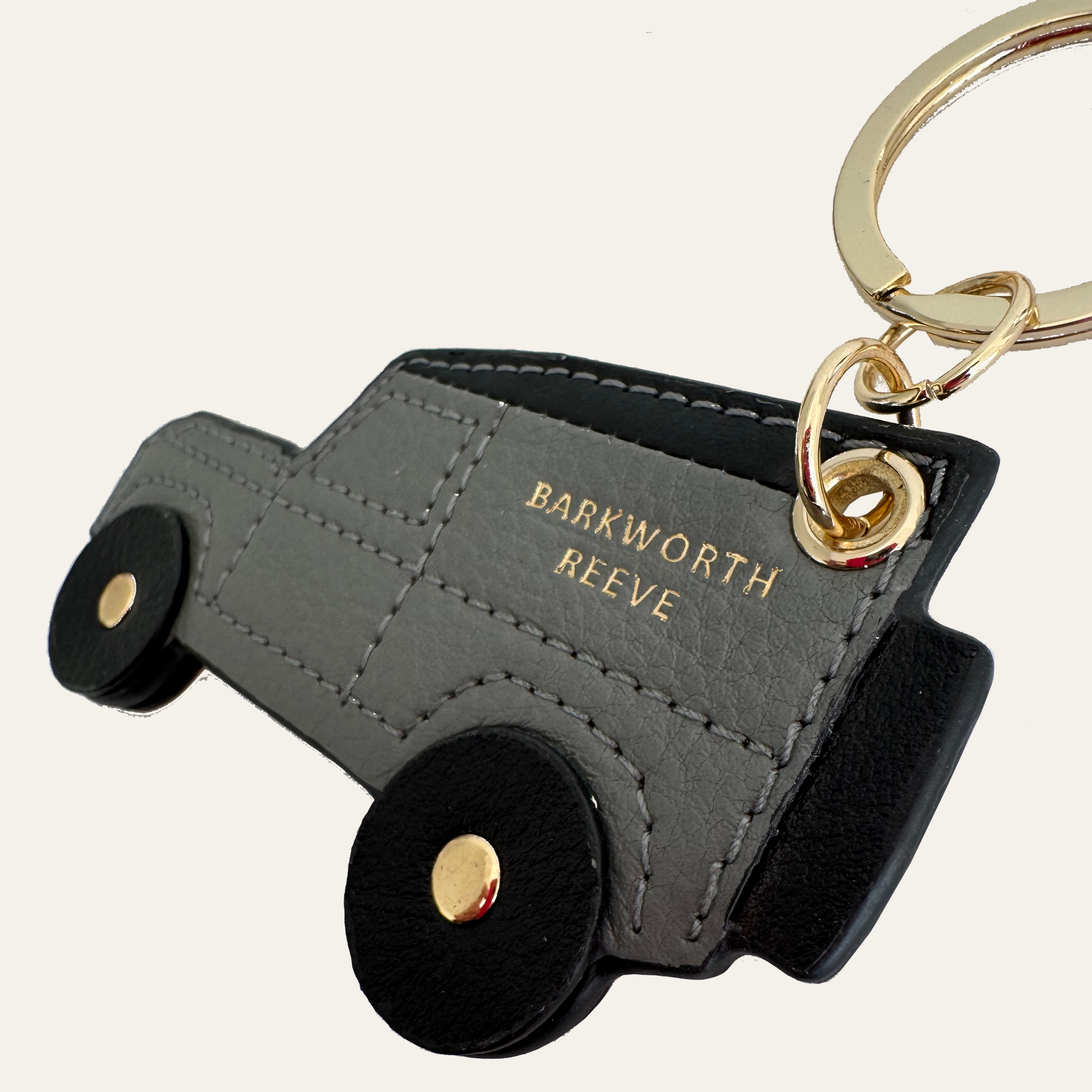 4x4 off road truck kerying in grey leather with black wheels