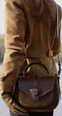 TWEED SADDLE BAG ON WOMANS BACK INFRONT OF LAKE