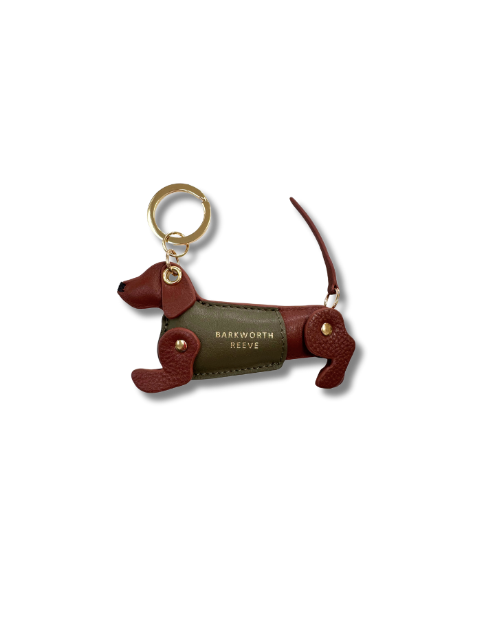 Conker & Khaki  sausage dog kweyring in a green coat. moving legs and tail. gold spit ring 