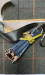 GREEN LEATHER AND LEAOPRD TASSEL LAID ON TWEED