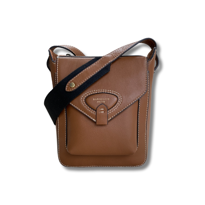 Tan leather cross body bag with pocket, flap and webbing cross body strap 
