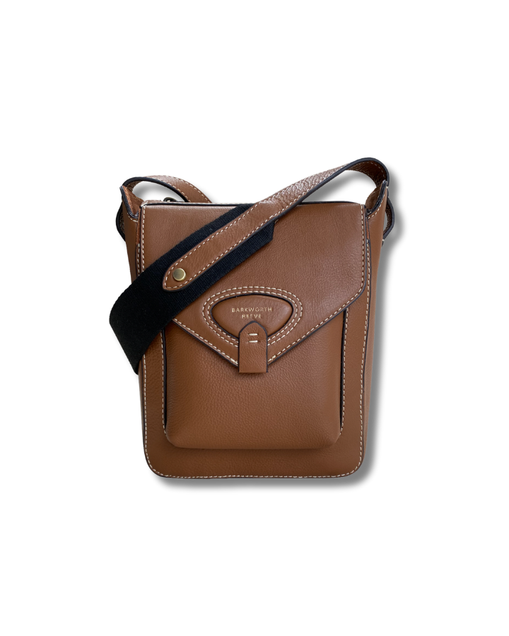 Tan leather cross body bag with pocket, flap and webbing cross body strap 