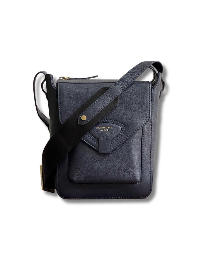navy leather cross body bag with flap, pocket and webbing cross body strap 