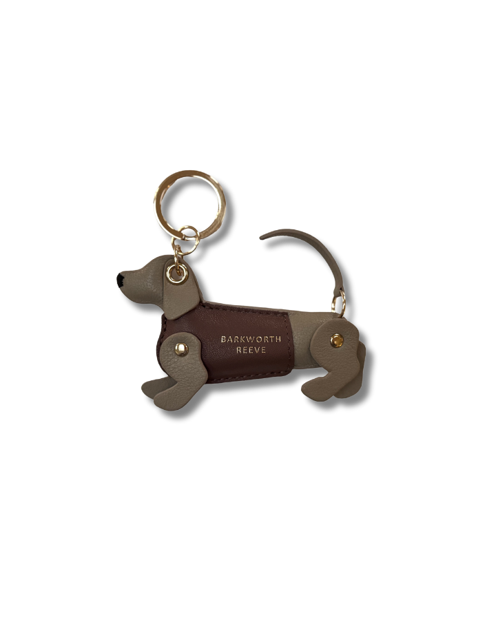 Isabella Mink & Pink sausage dog kweyring in a green coat. moving legs and tail. gold spit ring 