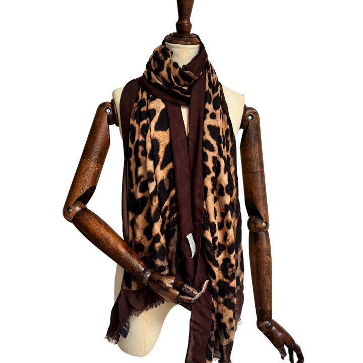 mannequin wearing leopard print scarf