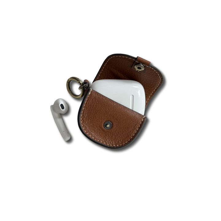 TAN LEATHER POCUH OPEN WITH AIRPODS STICKING OUT 