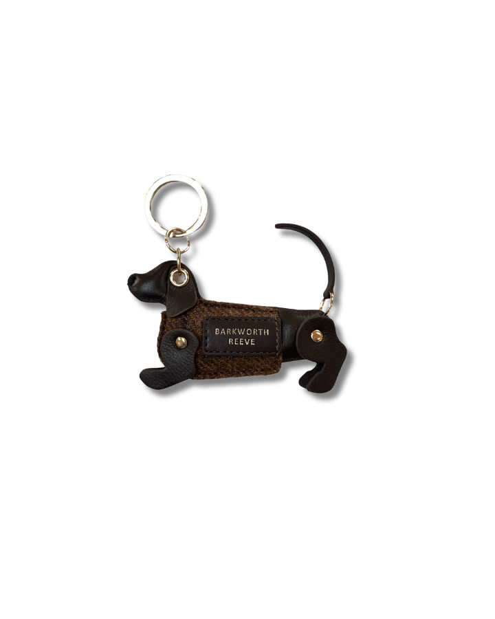 chocolate & tweed sausage dog kweyring in a green coat. moving legs and tail. gold spit ring 