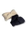 A baby knit hat set featuring a twisted headband in cream and a pair of booties in dark navy blue, displayed on a clean white background.