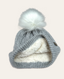 light grey marl bobble hat folded back with the faux fur liining and a white fur pom