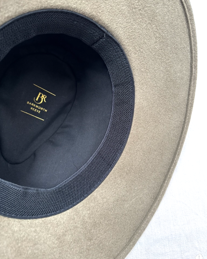 inteiror of olive green wool fedora with black lining