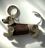 Isabella grey leather dachshund keyring, with deep pink leather coat and gold keyring split ring
