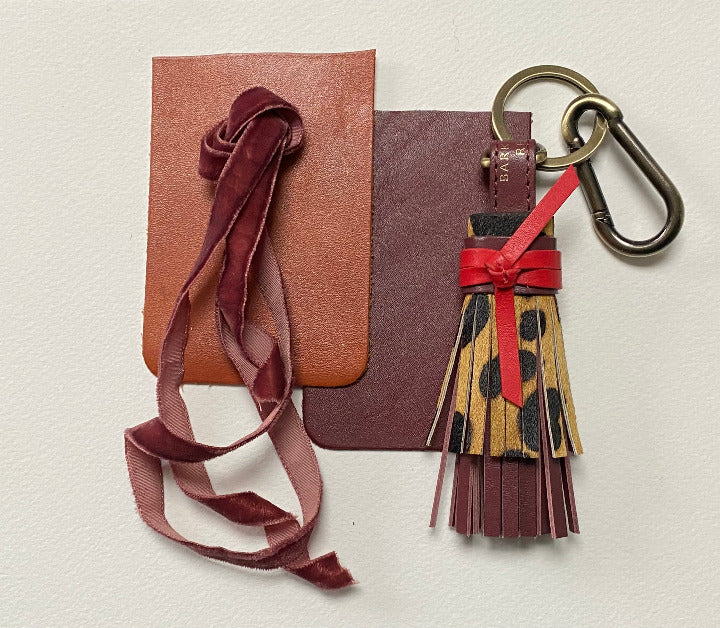 leopard tassel with red leather tie with leather swatches