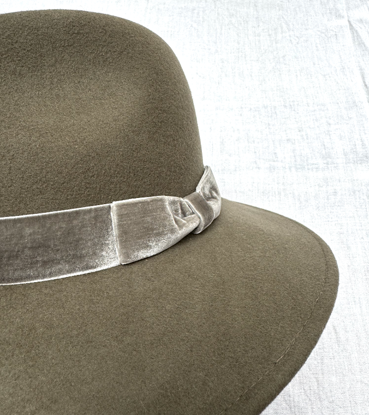 close up of olive wool fedora with a velvet band 
