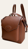 A tan leather rucksack with adjustable shoulder straps and a front flap closure.