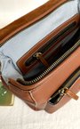 brown letaher rucsack with zipped topline opening 
